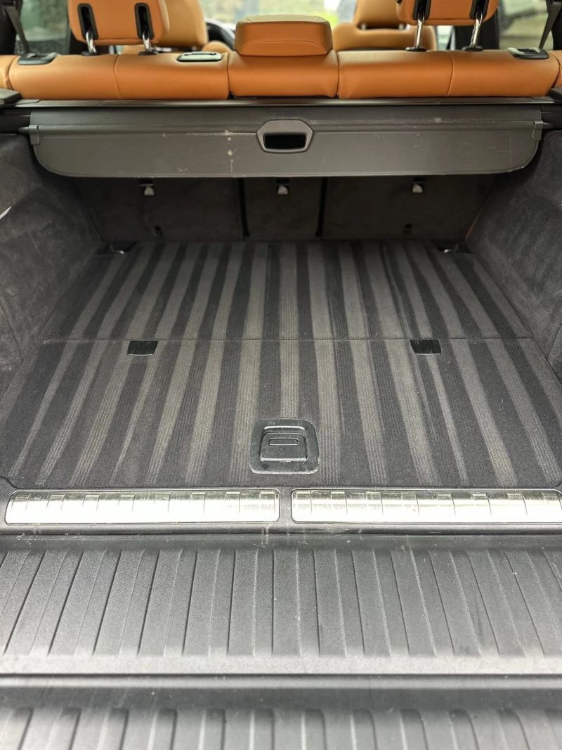 Well-detailed auto cargo area showing clean and spacious interior with striped flooring