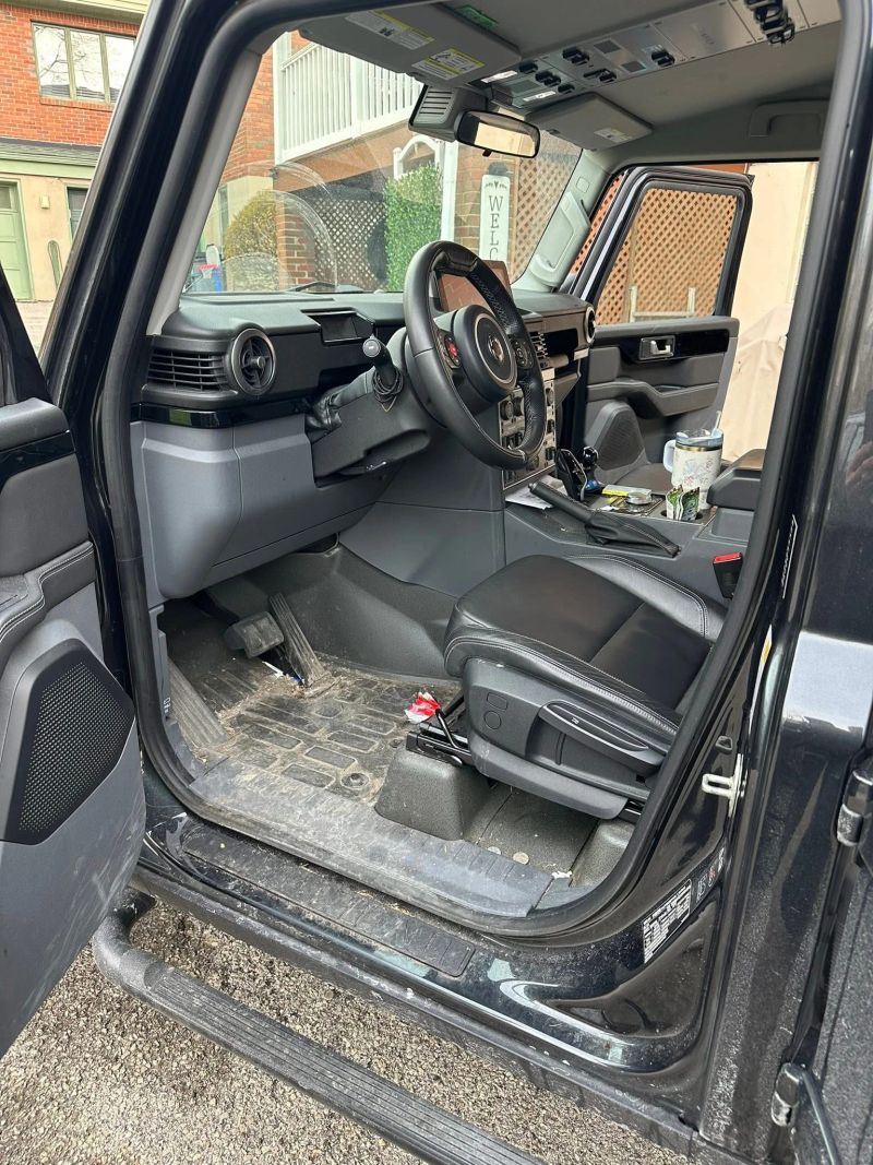 Interior view of a clean vehicle showing detailed dashboard and seating